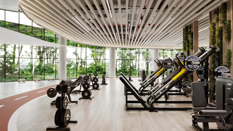 Light-filled gym with strength equipment and a view of greenery